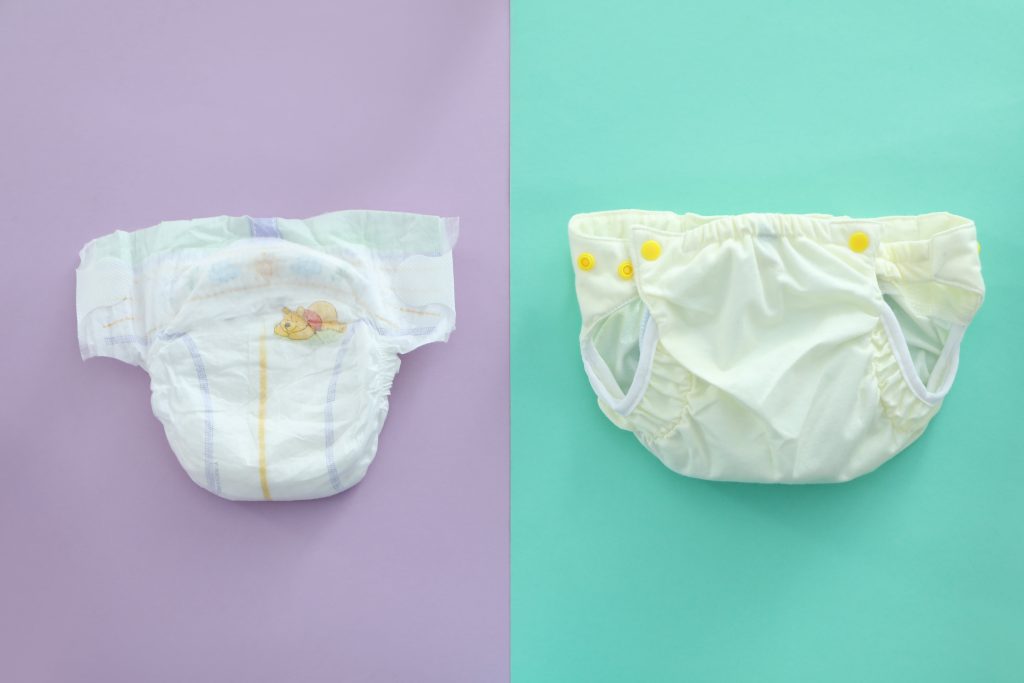 reusable diapers on two color background close up min 1024x683